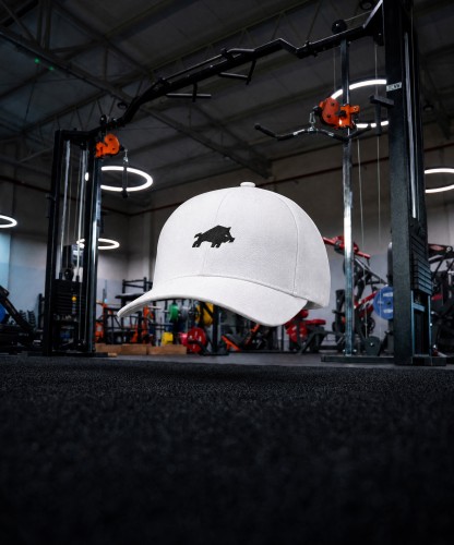 Generated with Kive.ai - Create a premium cinematic product photo of product using Gym as the exact unchanged background. Place the cap levitating in the empty foreground_ exactly in the horizontal center (1).jpg